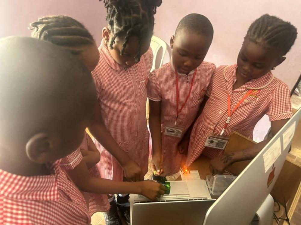 Team of students in uniform working on a build